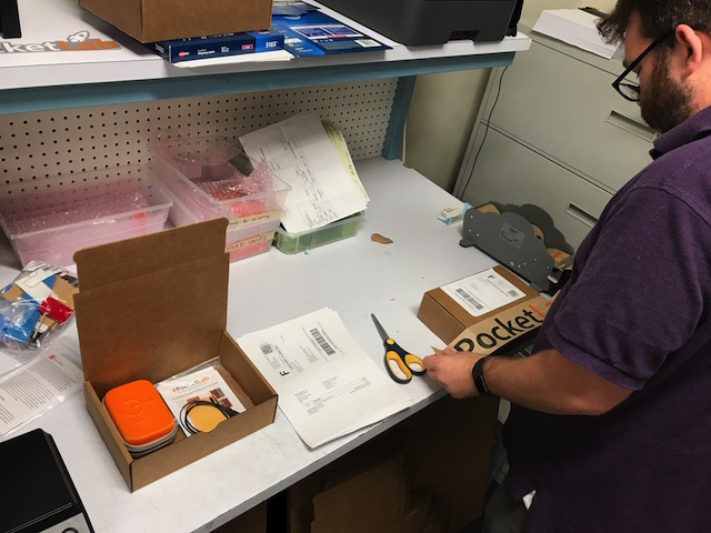 Robby boxing a customer order