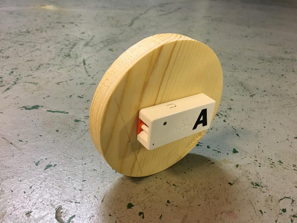 Wood Disk on Edge w/PocketLab Attached