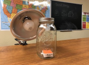 Heat lamp adding thermal energy to gas for NGSS MS-PS1-4